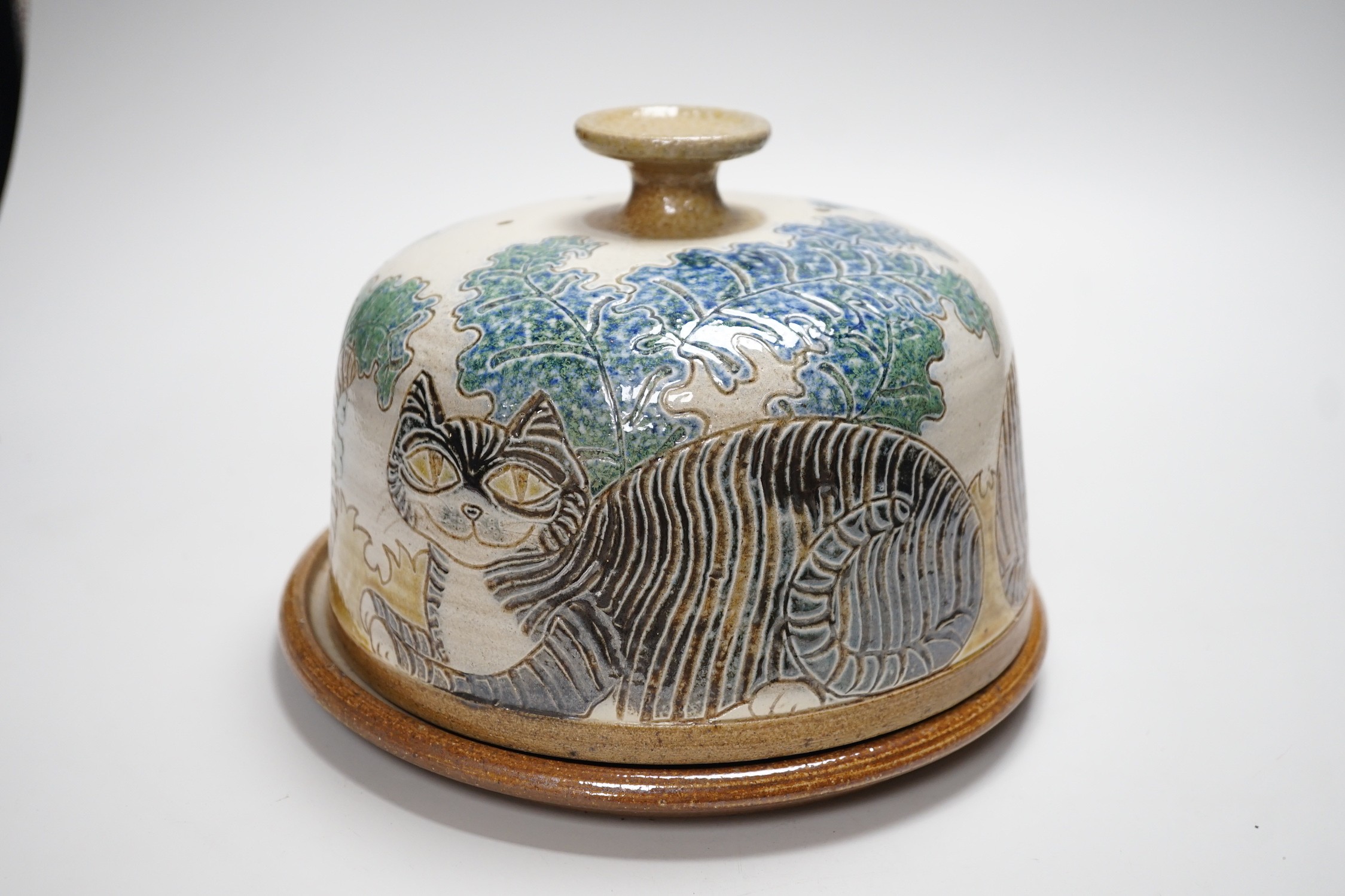Michael Mosse, a studio pottery cheese dish and cover, decorated with cats, 16cms high